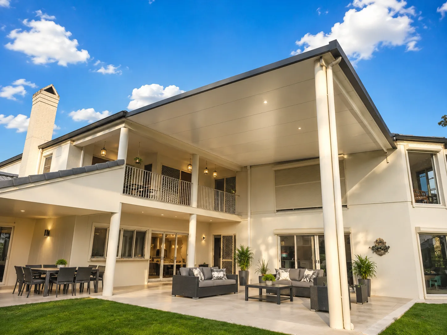 Large insulated attached patio built over the rear entertaining area of a two-storey Brisbane home
